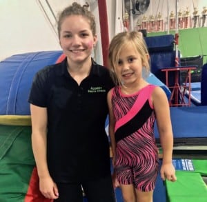 gymnastic coach with student