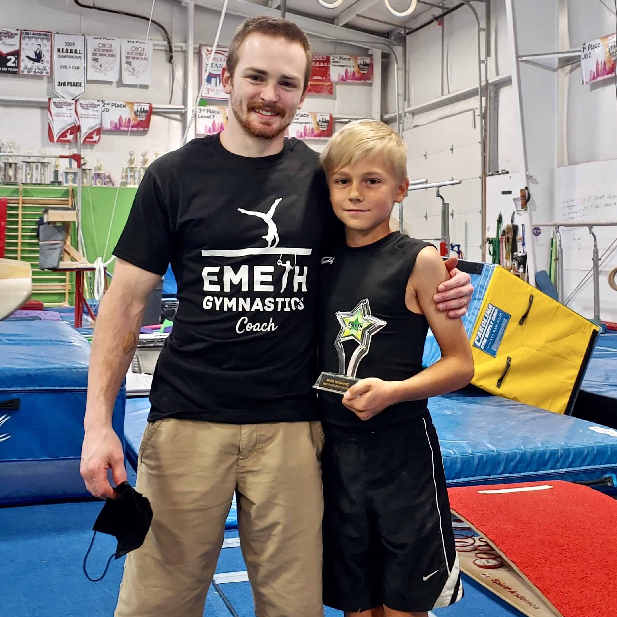 Boys gym coach with student at EmethGym