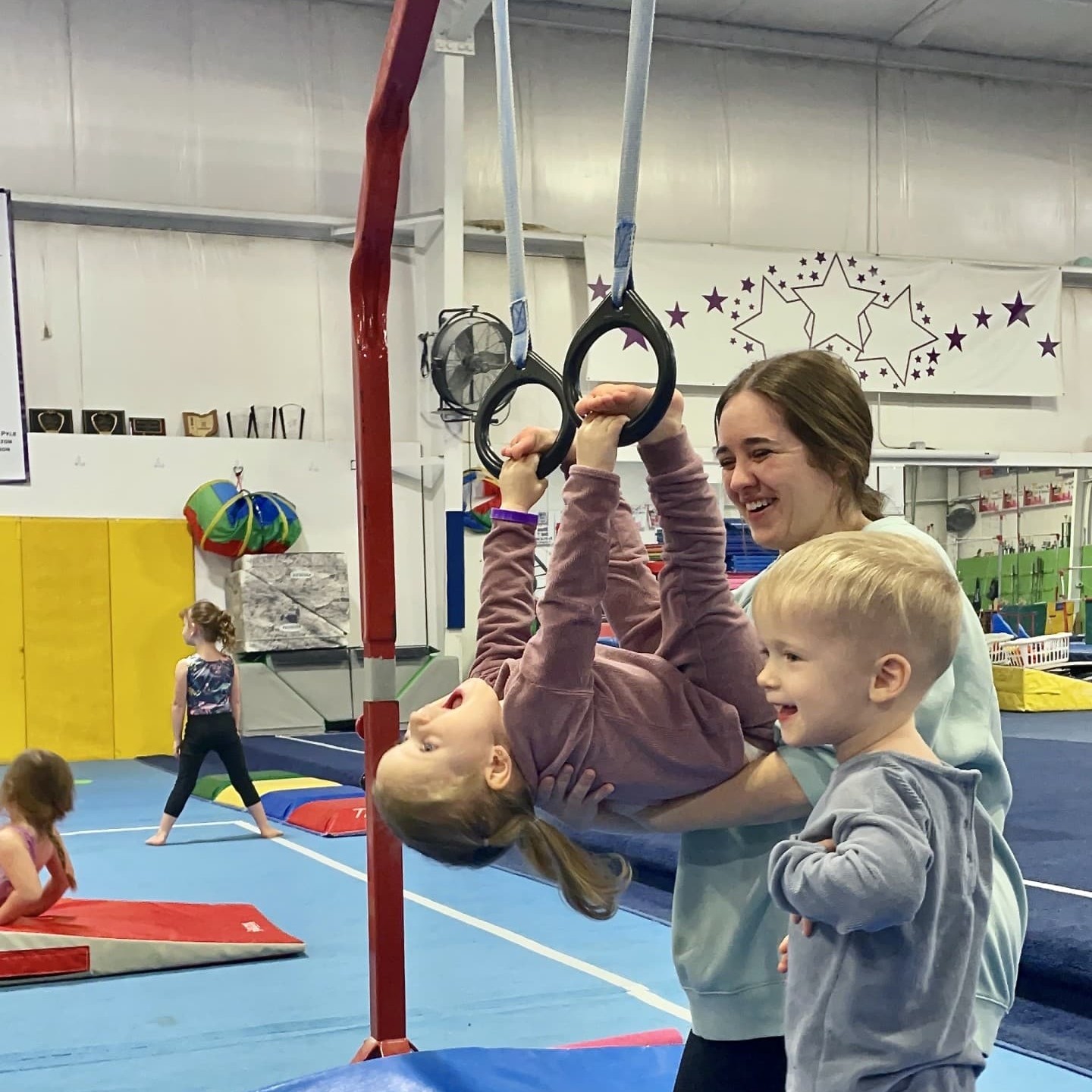 little boy with mom in toddler gymnastics